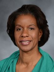 a woman smiling for a portrait