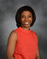 a woman smiling for a portrait