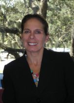 a woman smiling for a portrait