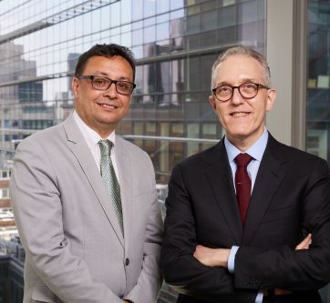 two men posing together