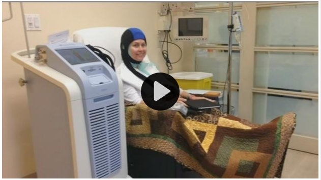 Breast cancer patient getting coldcap treatment to save her hair during chemotherapy