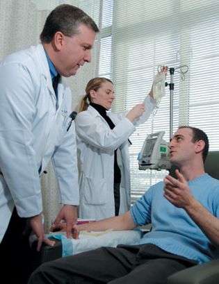 Photo of Dr. John Leonard with a patient