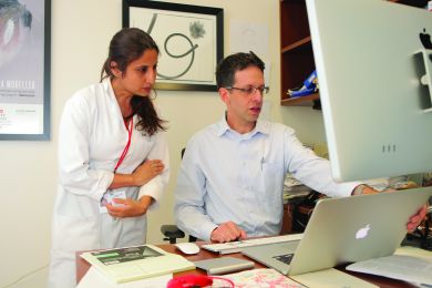 Dr.Yariv Houvras, right, with Dr. Ritu Kumar, an assistant professor of cell and developmental biology in surgery.