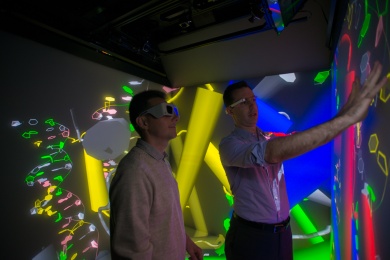 Photo of researchers in a 3D experience room