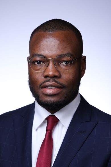 headshot of MCC Research Fellow, Dr. Okobi