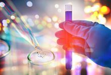 image of a hand holding a test tube