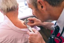 Doctor performing skin check